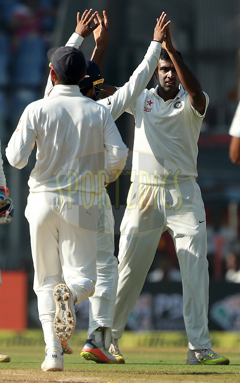 Ravichandran Ashwin of India celebrates the wicket of Chris Woakes of England during day 5 of the fourth test match between India and England held at the Wankhede Stadium, Mumbai on the 12th December 2016.<br />
<br />
Photo by: Ron Gaunt/ BCCI/ SPORTZPICS