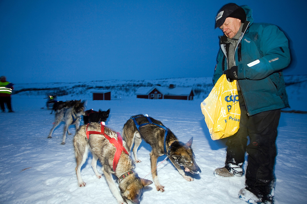 The Finnmarksløpet 2007, 10th - 17th March. At 1000km, this is the longest and northernmost dog sledging race in Europe. .3rd placed contestant Harald Tunheim, arrives at the check point of Joatka.
