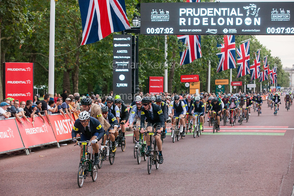 London, UK. 3 August, 2019. More than 500 smartly-dressed Brompton riders compete in the Brompton World Championship Final. Starting with a Le Mans-style dash, the race takes place over a 16km 8-lap circuit around St James's Park. It was the fifth successive year that the race had featured as part of the Prudential RideLondon event.