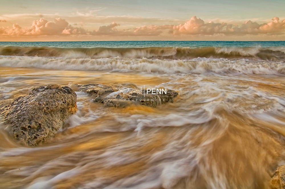 Continuous Waves breaking on the beach on Caves Beach New Providence, The Bahamas