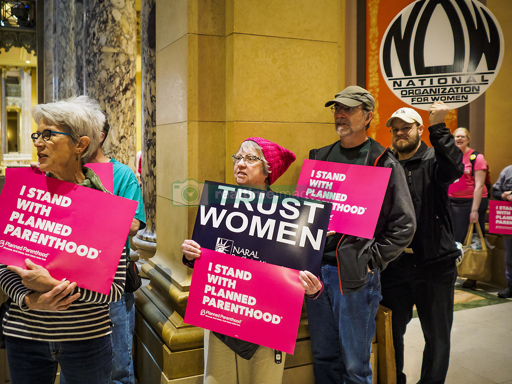 May 4, 2017 - St. Paul, Minnesota, United States - Women and men line the hallways of the Minnesota Capitol and chant pro-choice slogans. About 50 people came to a protest to urge Minnesota State Senators to vote against two bills supported by the Republican party that would restrict access to women's health care in Minnesota. The protest was organized by NARAL Pro-Choice Minnesota, NCJW Minnesota, and Planned Parenthood Minnesota. The Senate passed the bills but Minnesota's Democratic governor is expected to veto the legislation when it reaches his desk. (Credit Image: © Jack Kurtz via ZUMA Wire)