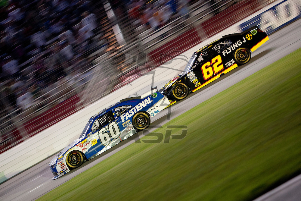 Hampton, GA - SEP 03, 2011: Carl Edwards (60) races down the front stretch for the Great Clips 300 race at the Atlanta Motor Speedway in Hampton, GA.